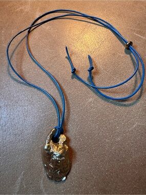 Gold brass pendant necklace textured shell beach mermaid on blue leather cord